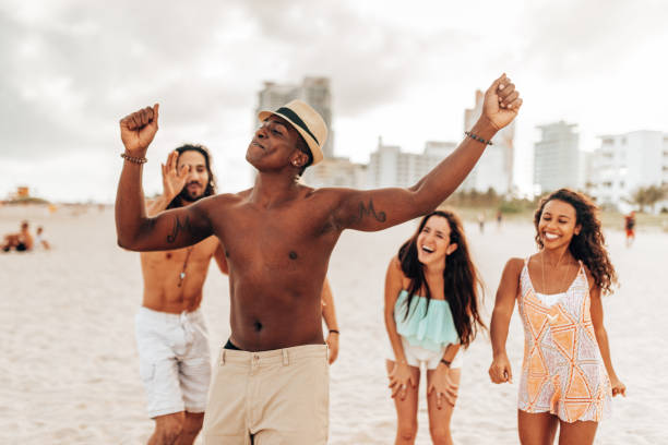 istock friends dancing on the beach 1425930349