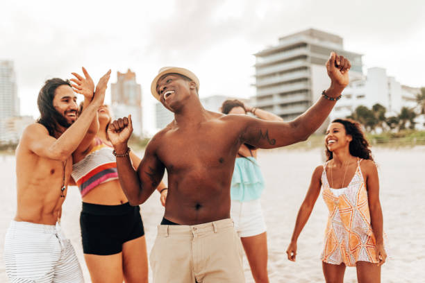 istock friends dancing on the beach 1425930413