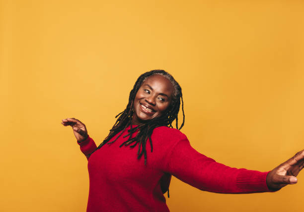 istock Cheerful black woman dancing in a studio 1425932391