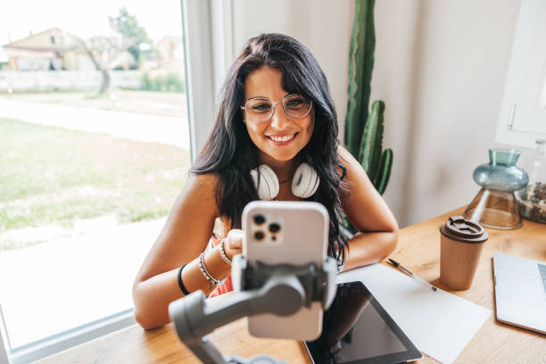 istock Influencer broadcasting a live streaming to the communituy 1425936133
