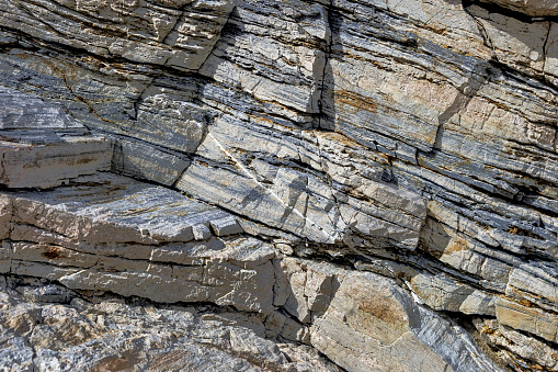 closeup of grey layered rocks for background use