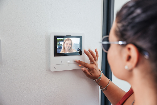 Video intercom displays a friend at the door.