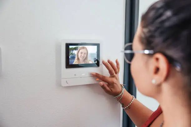 Video intercom displays a friend at the door.