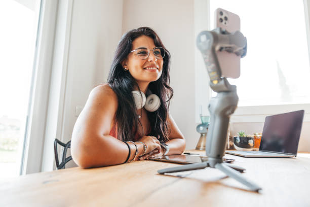 istock Influencer broadcasting a live streaming to the communituy 1425938308