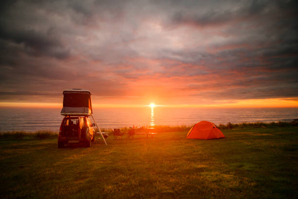 Warm Midnight sun camping in Summer stock photo