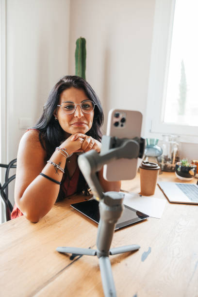 istock Influencer broadcasting a live streaming to the communituy 1425938968
