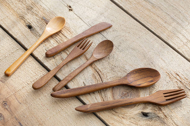 istock Wooden spoon and fork on wood texture of dining table 1425940186