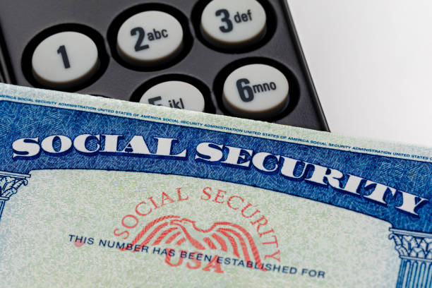 Social security card and telephone. Fraud, scam and identity theft concept. stock photo