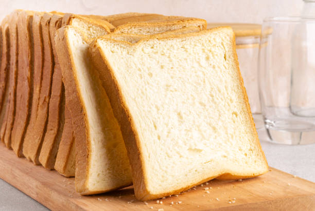 istock Stack of slice bread isolated on bright background. Close up. 1425956381