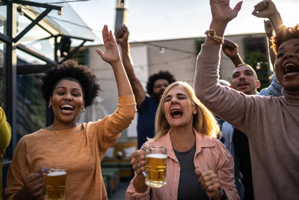istock Friends celebrating in a rooftop bar 1425956552