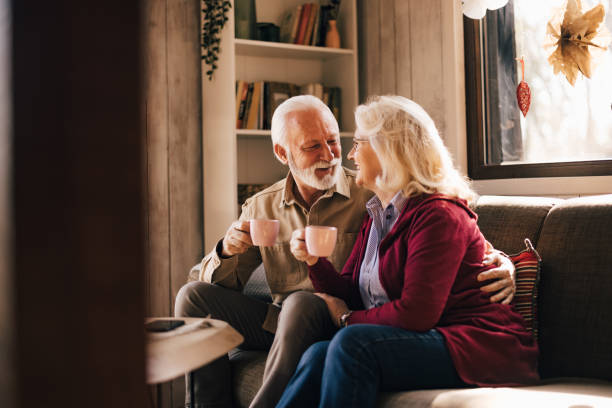 istock Two mature lovers, spending time together at home, drinking a mo 1425958418