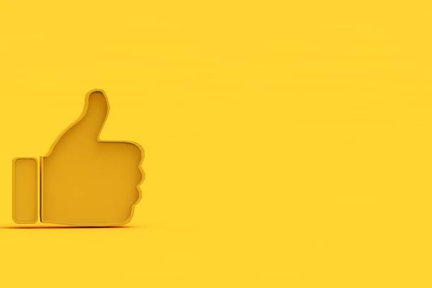 istock Thumb up gesture on yellow background 1425959189