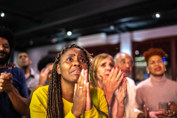 Sports fans watching a match at a bar Sports fans watching a match at a bar black people bar stock pictures, royalty-free photos & images