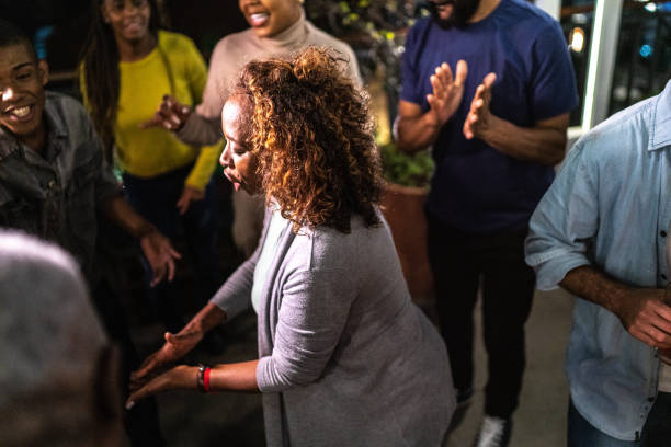 istock Happy friends dancing during party at night 1425963136
