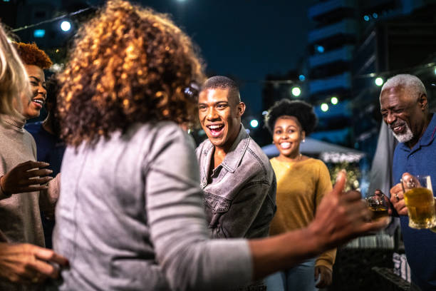 istock Happy friends dancing during party at night 1425963174