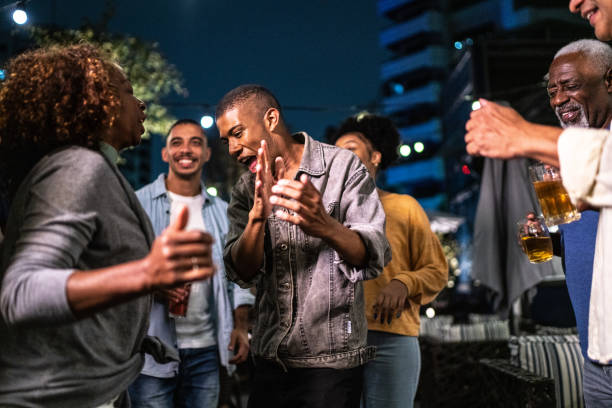 istock Happy friends dancing during party at night 1425963224