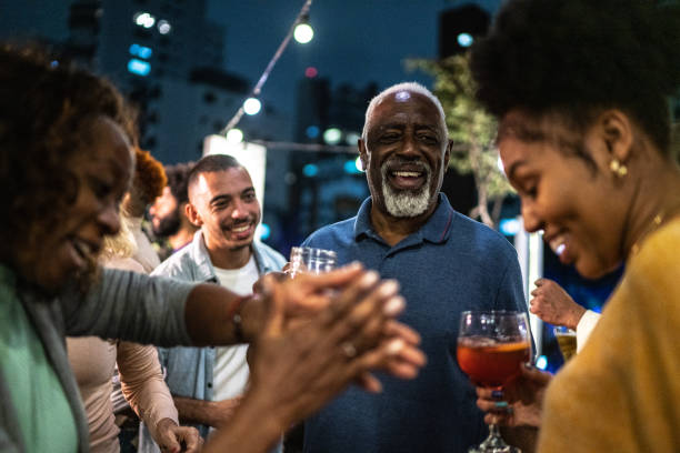 istock Happy friends dancing during party at night 1425963262