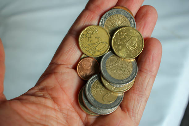 istock euro coins in my hand 1425966428