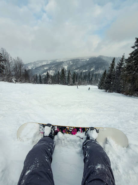 istock snowboarder at the hill enjoying mountains landscape 1425967051