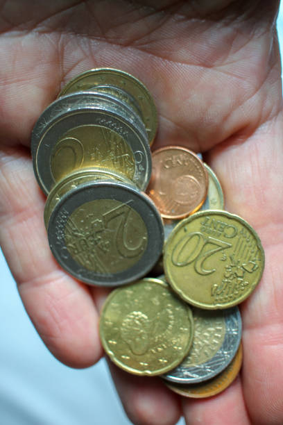 istock some euro coins in my left hand 1425967234