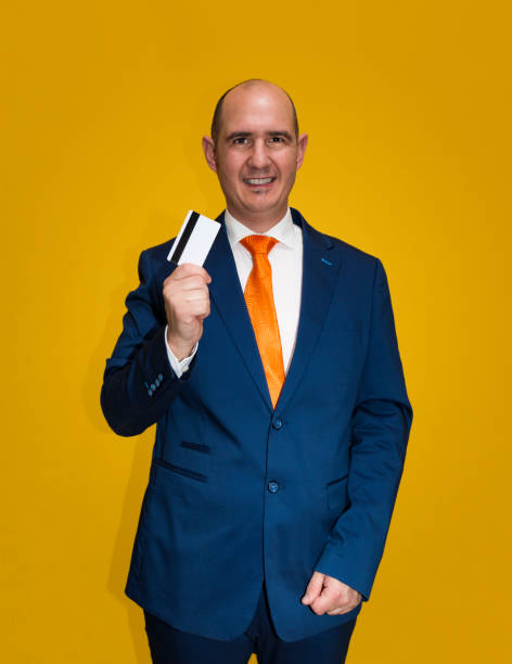 istock Well-dressed man with a paying card 1425968046