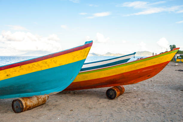 Nevis; November 20, 2011; Fishing boats along the beach in Nevis with St. Kitt's in the distance