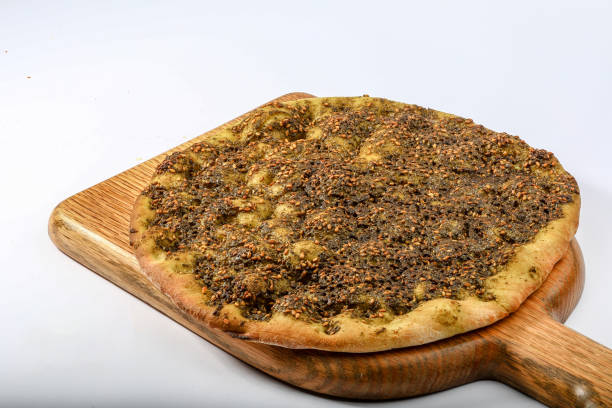 THYME PASTRY pizza served in a cutting board isolated on grey background top view of arabian fastfood stock photo