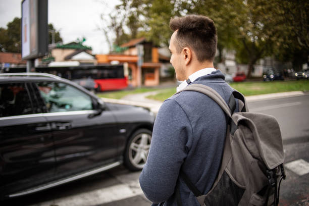 istock Student at the bus station 1425973900