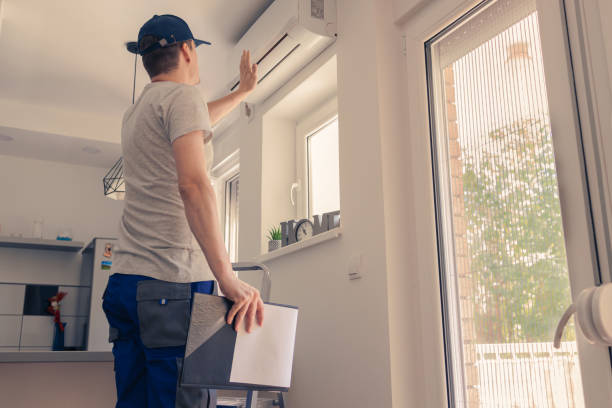 istock Male technician checking air conditioner indoors. 1425979070