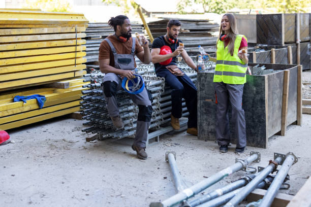 istock Multicultural Group of Building Workers are Taking a Rest and Refreshing with Food and Drink. 1425980585