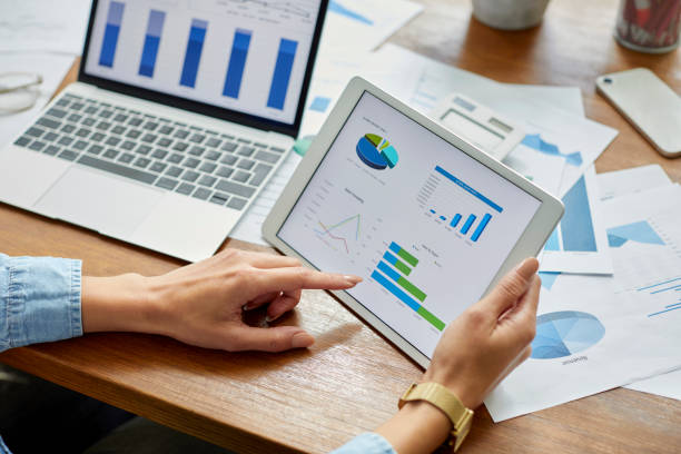 istock Businesswoman analyzing financial graph on digital tablet 1425982416