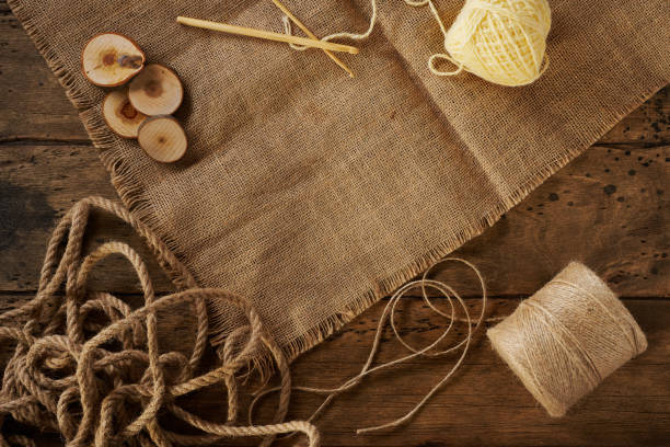 balls of woolen thread on a wooden background top view. Space for text.