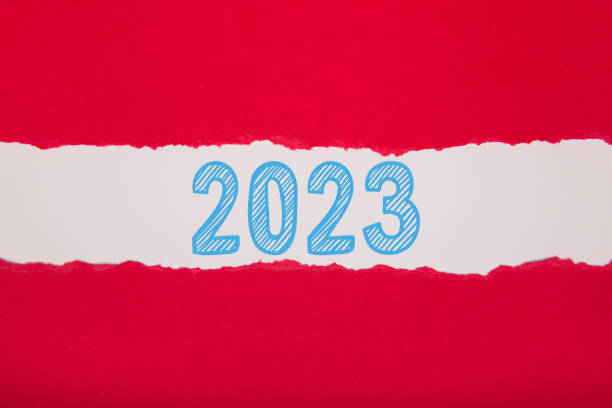 istock Torn Paper With Happy New Year 2023 On White Background 1425986939