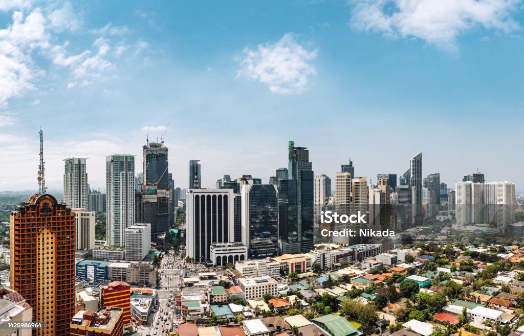 Skyline of Manila, Philippines View on high rise condo buildings in Makati by the River Pasig Manila - Philippines Stock Photo