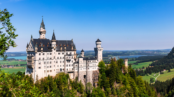 Honau - Reutlingen, Germany - September 30th, 2018: Done point of view Panorama over the Swabian Jura - Schwäbische Alb - with beautiful fairy-tale Castle Lichtenstein on top a steep rock on a sunny late summer day. Swabian Alb, Reutlingen, Baden Wurttemberg, Germany, Europe