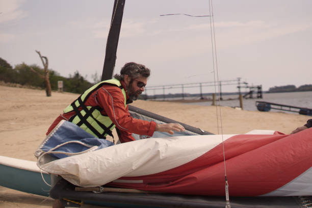 man preparing catamaran