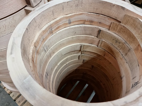 Round formed pieces of wood prepared as early stage to assamble a chair.