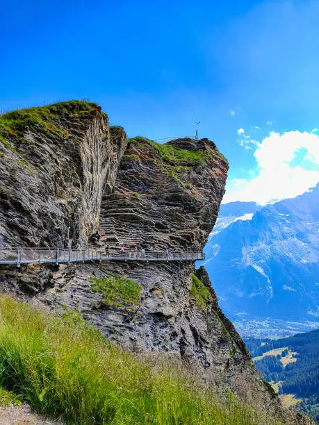 Famous Suspension Bridge in the Swiss Alps to walk around a cliff. The bridge is located in the First region (Grindelwald, Lauterbrunnen).