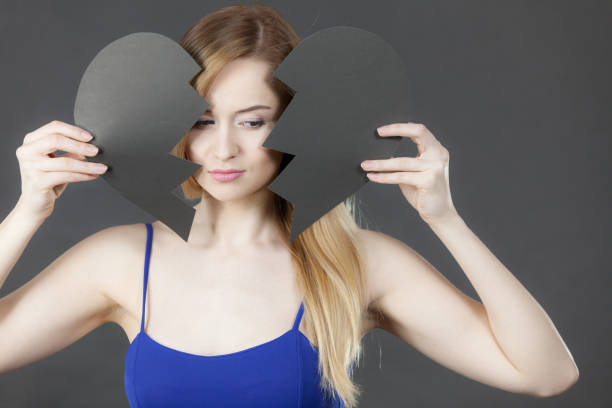 istock Unhappy woman with broken heart. 1425999079