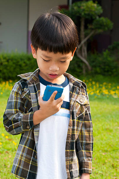 istock Asian boy calling telephone 142599979