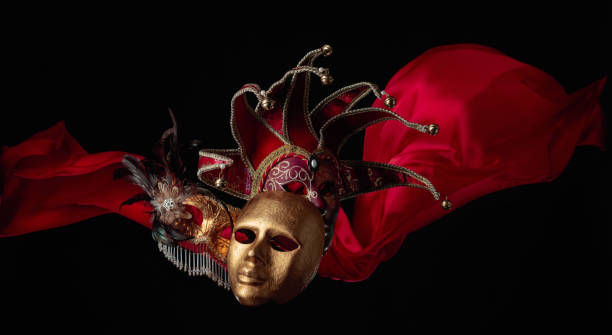 istock Old carnival masks with flutters red cloth. 1426002118