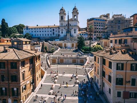Daytime busy aerial view of Spanish Steps (Piazza di Spagna) in Rome, Italy. Busy touristic place.