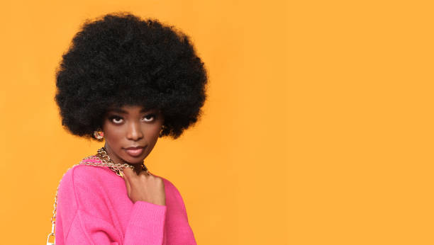 istock Afro american young woman with gold jewelry. 1426004607
