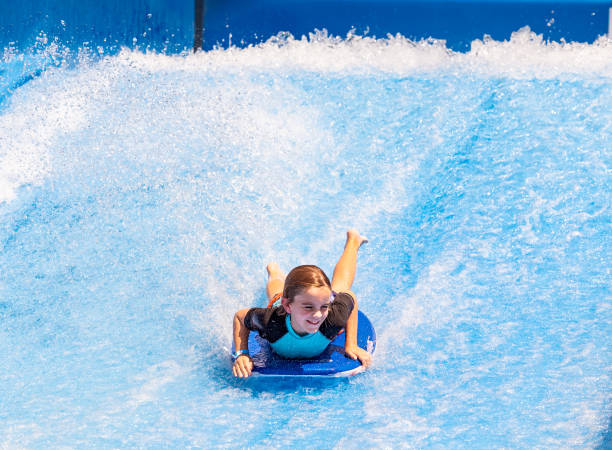 istock Young boy descends waterslide at speed 1426004734