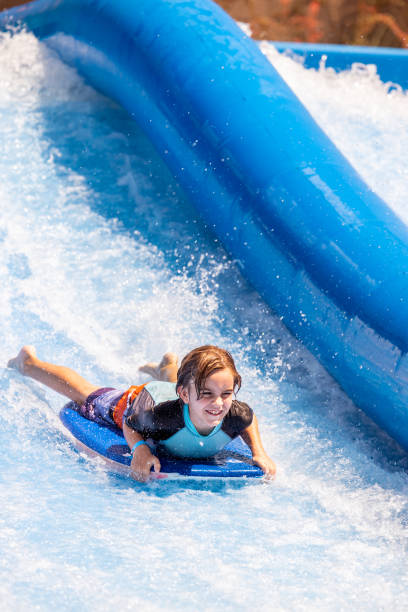 istock Young boy descends waterslide at speed 1426004811