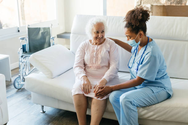 istock Nurse consoling senior patient at home 1426005193