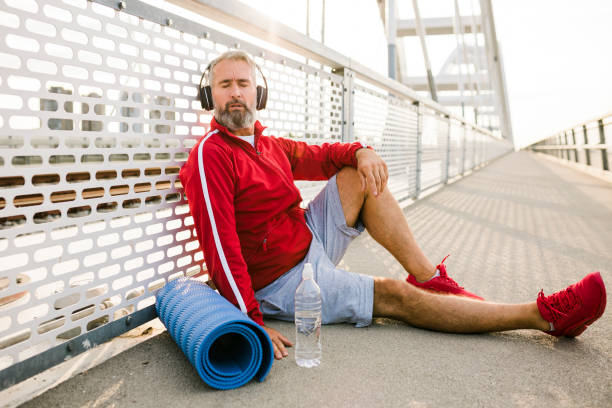 istock Senior man resting after jogging outdoors 1426007454