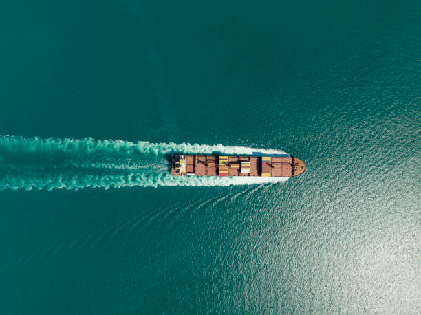 Cargo ship in import export and business logistic, Logistic and transportation of International Container Cargo ship in the open sea, Aerial shot from drone.