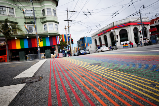 Vibrant strips of color painted across the sidewalks to show support for the LGBTQIA+ community in San Francisco, California.
