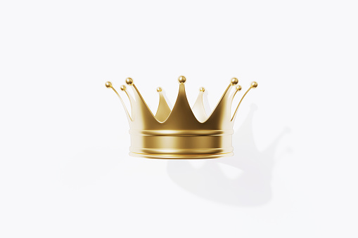 Gold crown isolated on white background. Horizontal composition with clipping path and copy space. Luxury and award concept.